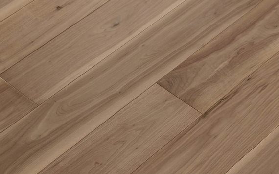 Engineered wood planks floor in American Walnut: brushed, stained, varnished.