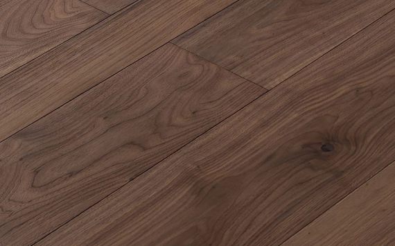 Engineered wood planks floor in American Walnut: brushed, stained, varnished.
