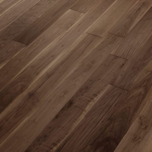 Engineered wood planks floor in American Walnut: brushed, stained, varnished.