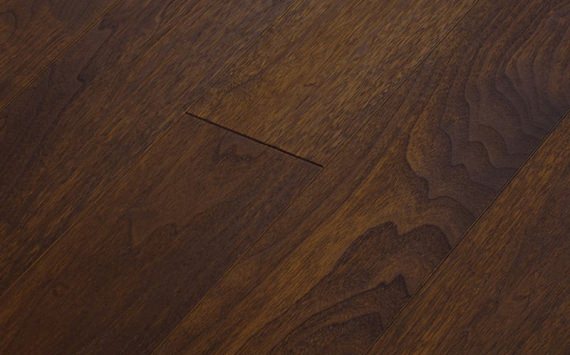 Engineered wood planks floor in American Walnut: brushed, stained, varnished.