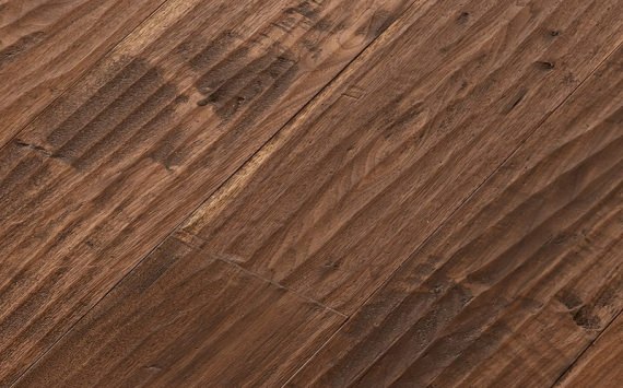 Engineered wood planks floor in American Walnut: hand planed, aged, stained, varnished.